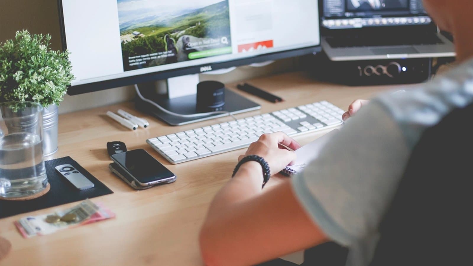 Person browsing a website on a desktop computer